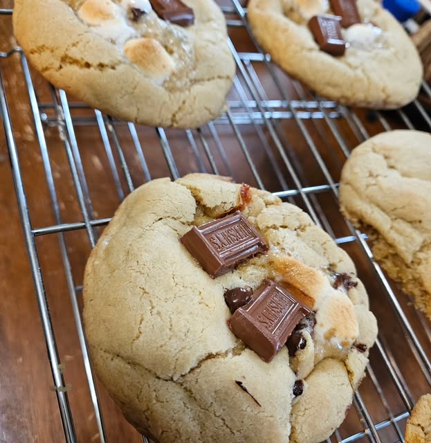Warm fresh s'mores cookies with melted Hershey chocolate and toasted marshmallow
